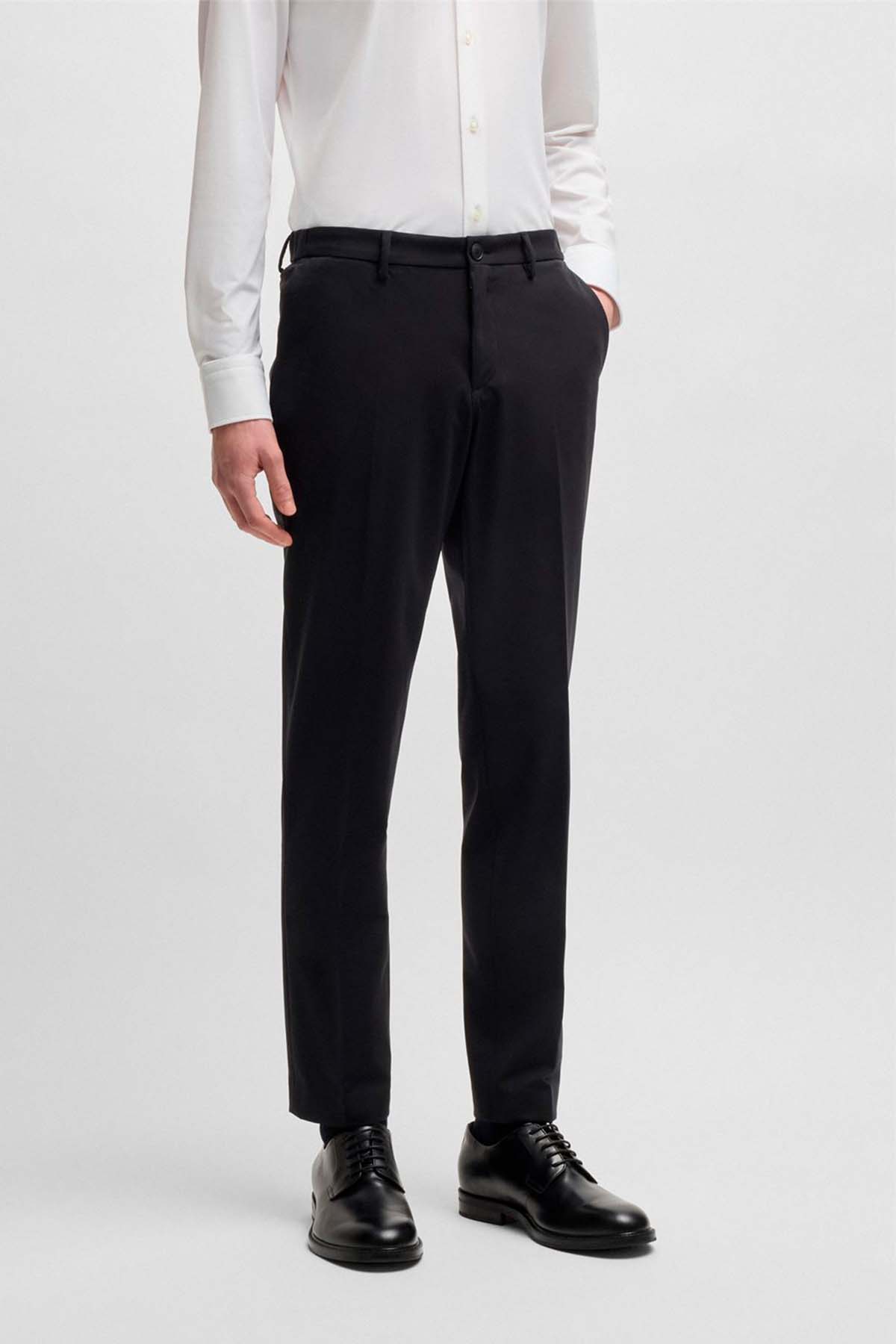 Pantalones slim fit de punto elástico técnico